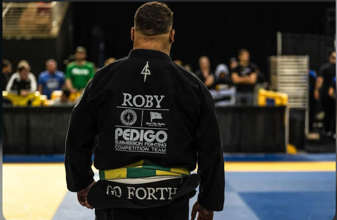 Our athlete confidently wearing the Go Forth Kimono, patches, and belt.