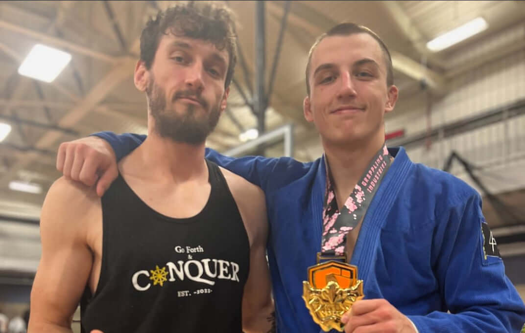 Our athlete Jeffery Larsen posing with a gold medal from Grappling Industries.